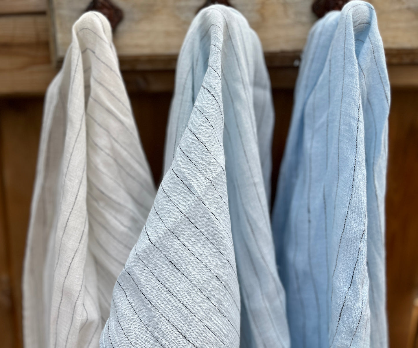 Three colors of linen scarf with pinstripes.