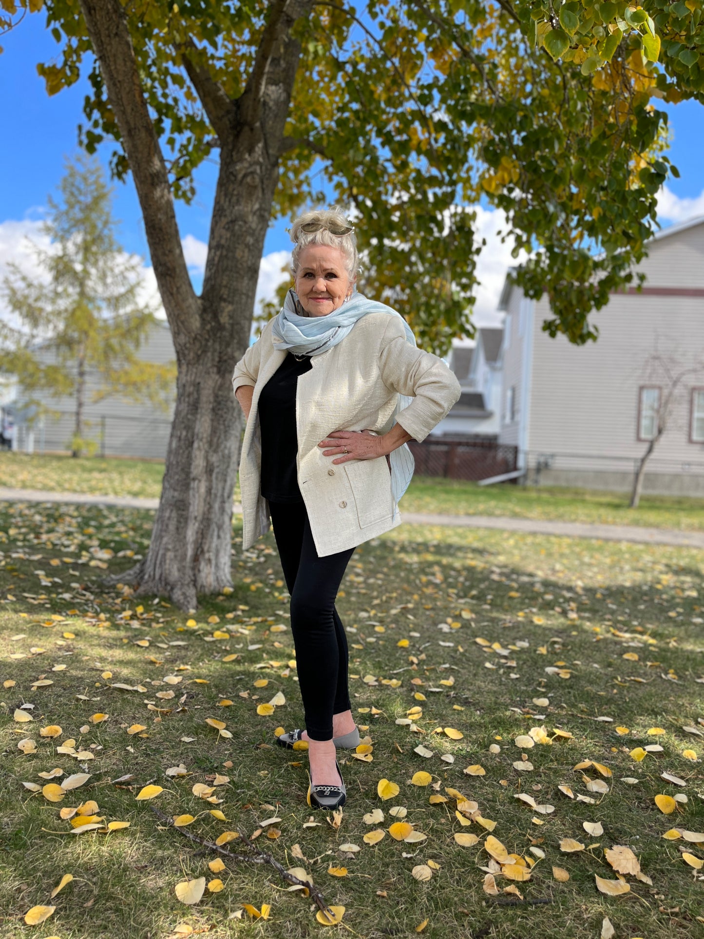 Woman wearing our light blue linen pinstripe scarf.
