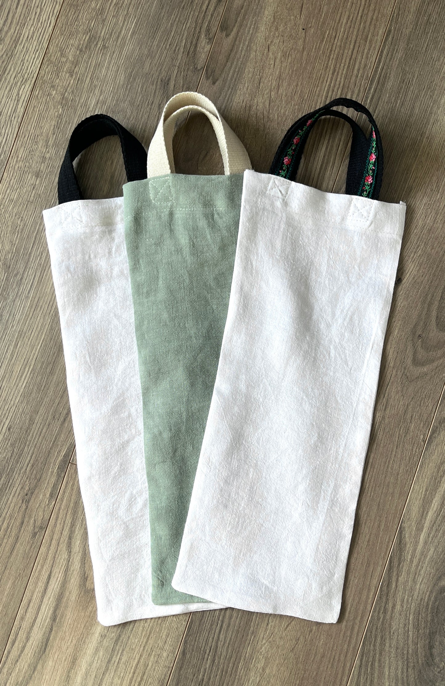 Three linen gift bags for bottles.